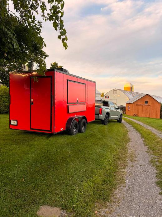 The food trailer hitched up at the winery at sunset
