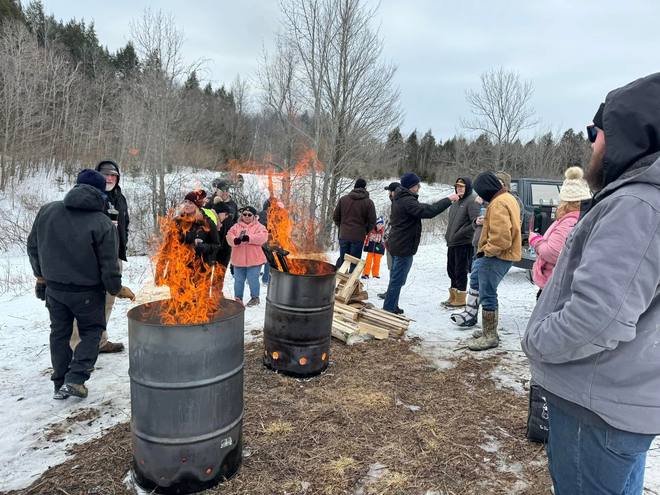 Barrel fires and a bundled-up crowd at the Winter Carnival