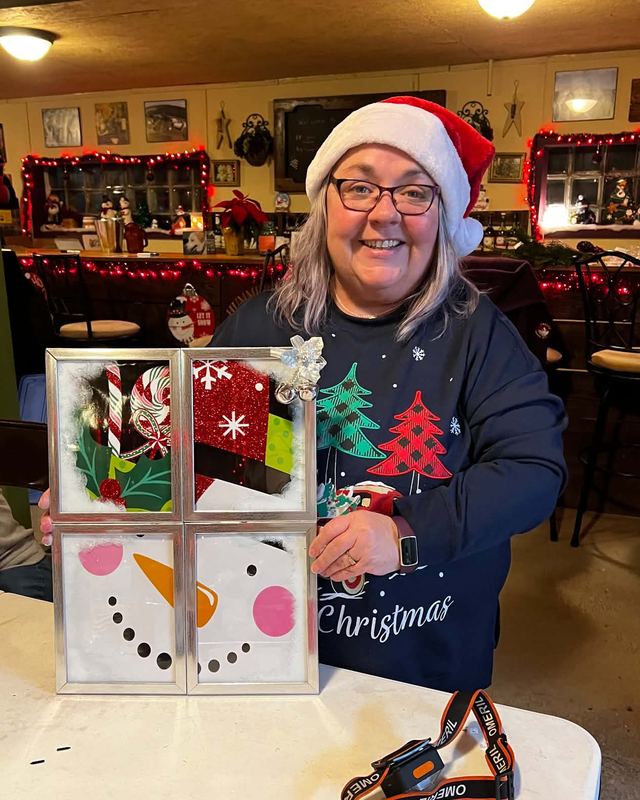 Kimm Schick in the tasting room holding a craft from one of the winery's craft nights